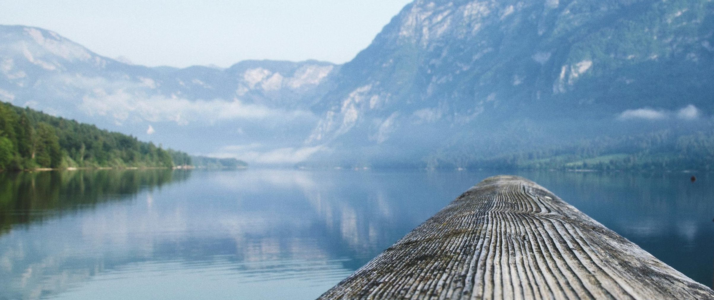 Serene lake with mountain dock